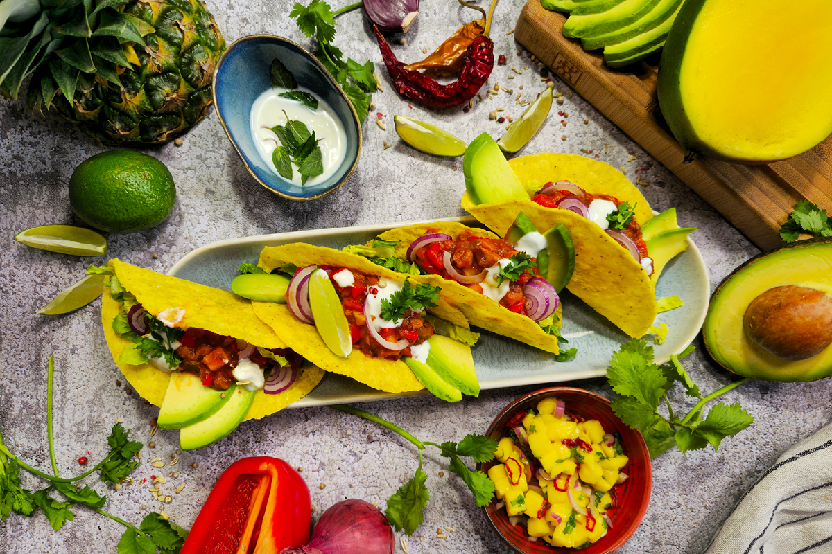 Tropical tacos with spicy minced soy, mango salsa and coconut-lime crema