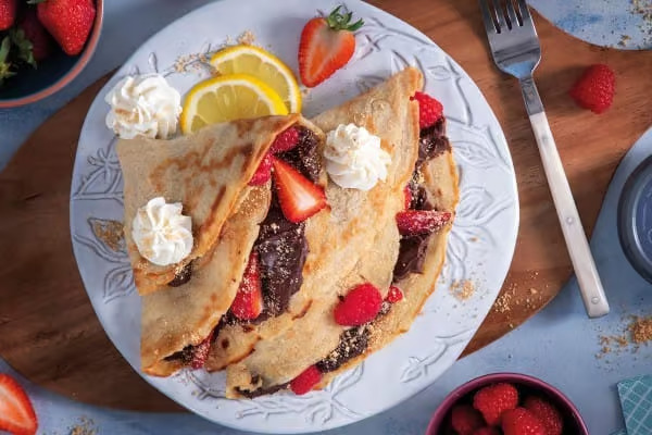 Vegan pancakes with chocolate and berries